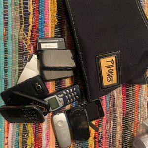 Old Cell phones and beepers with bag. Was used in a movie set.